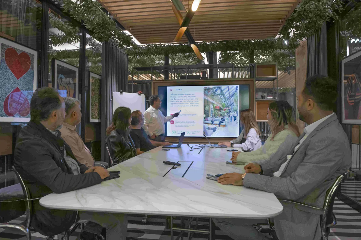 Team watching a platform demo